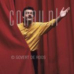 Herman Finkers (Date Unknown) on stage.

[keywords]On Stage, Half Lenght, Smiling, Curtain[/keywords]